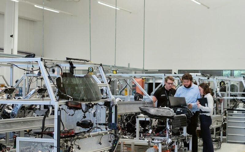 engineers working in automotive factory